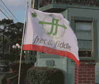 Fret & Fiddle flag waves outside of Hop Dogma in 2019